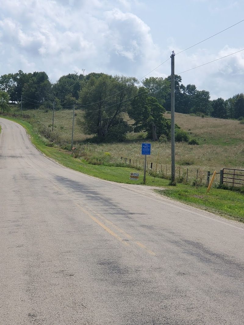 A Road Where Cars Appear To Roll Uphill