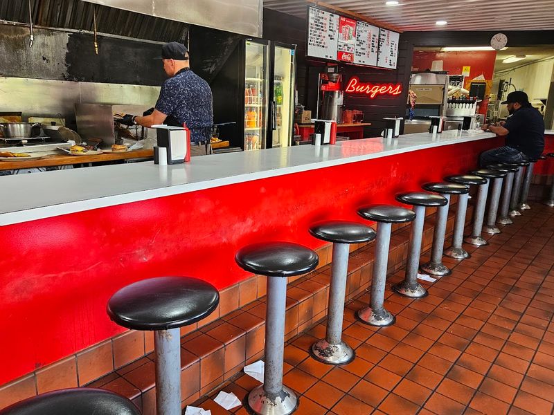 The 1950s Diner Atmosphere Inside A Red-Walled Space