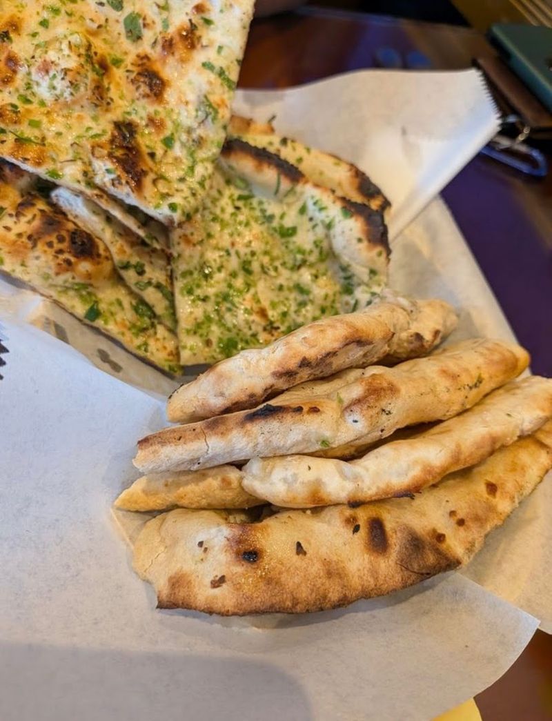 Freshly Baked Garlic Naan From A Tandoor Oven