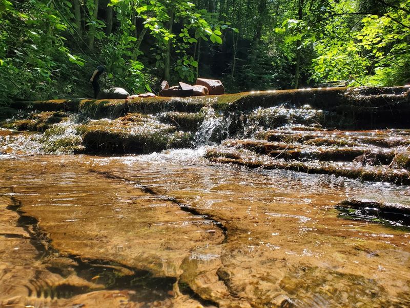 Smaller Cascades Add More Movement Above And Below The Main Falls