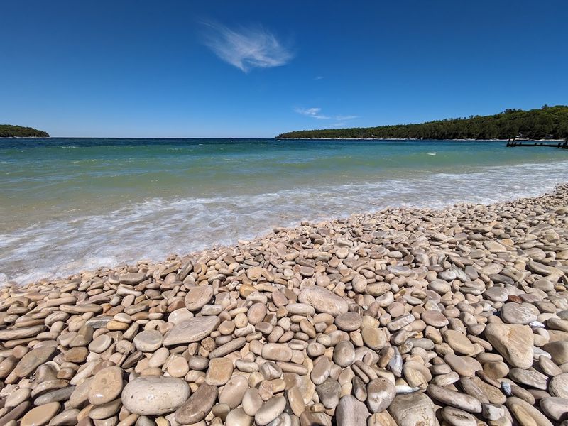 The Beach Is Covered In Smooth Limestone Pebbles