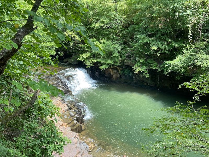 The Blue Hole Swimming Pool That Gives The Falls Its Name