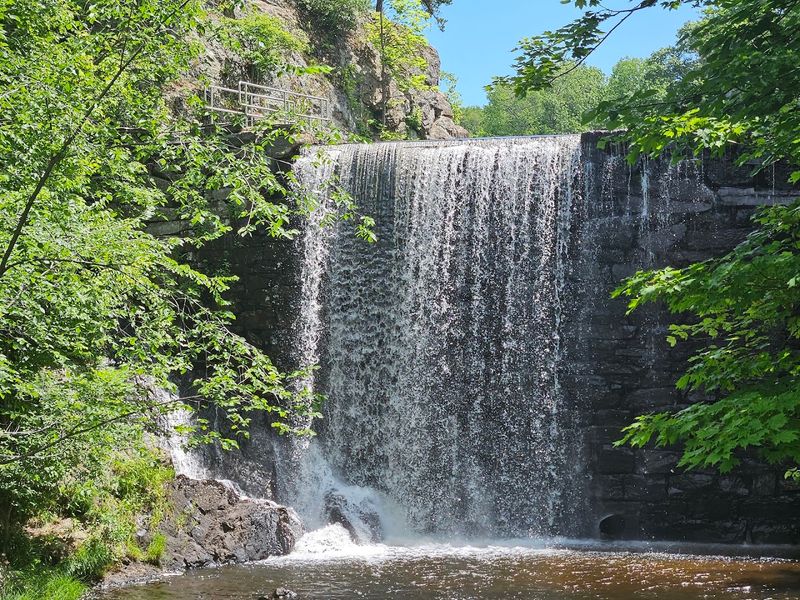 The Natural Waterfall That Sets This Pond Apart