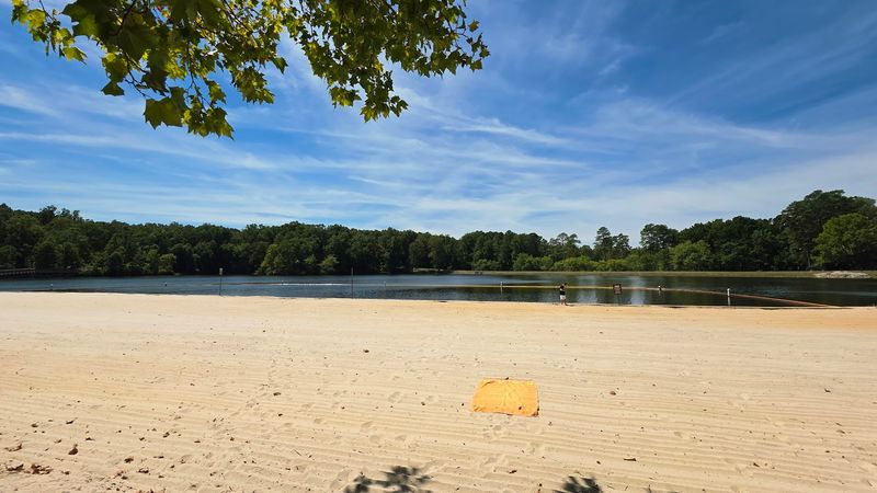 Lake Placid And Its Sandy Swimming Beach