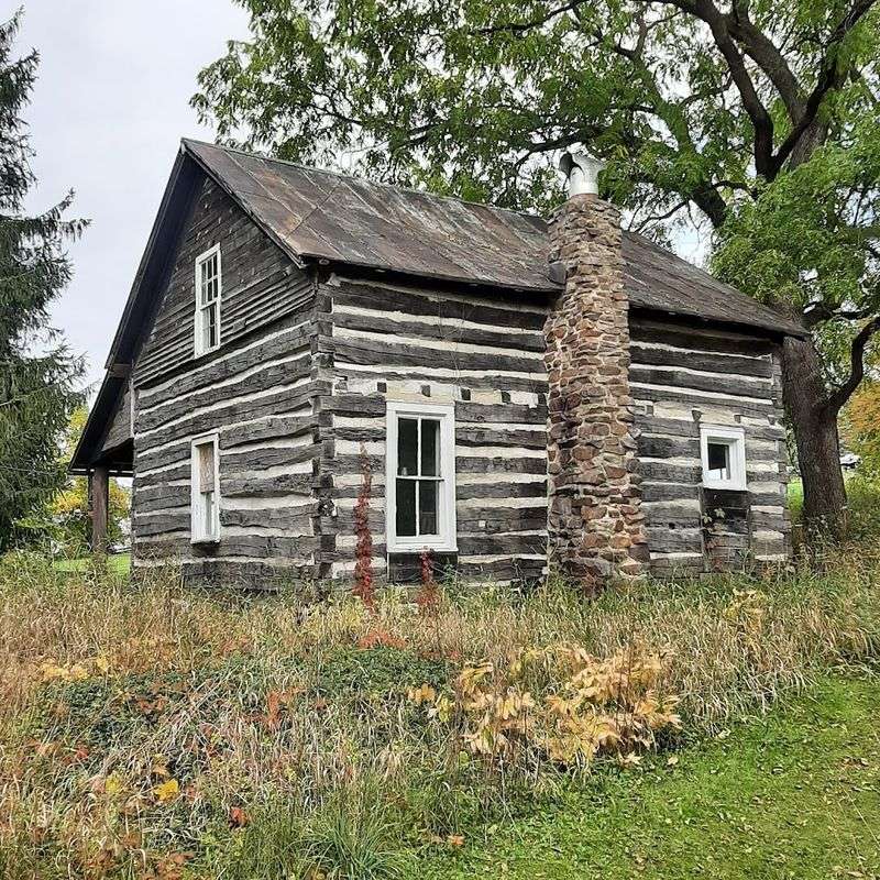 A Historic 1862 Log Cabin Still Stands On The Property