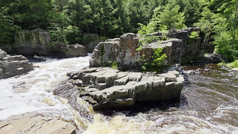 The River Cuts Through A Narrow Rocky Gorge