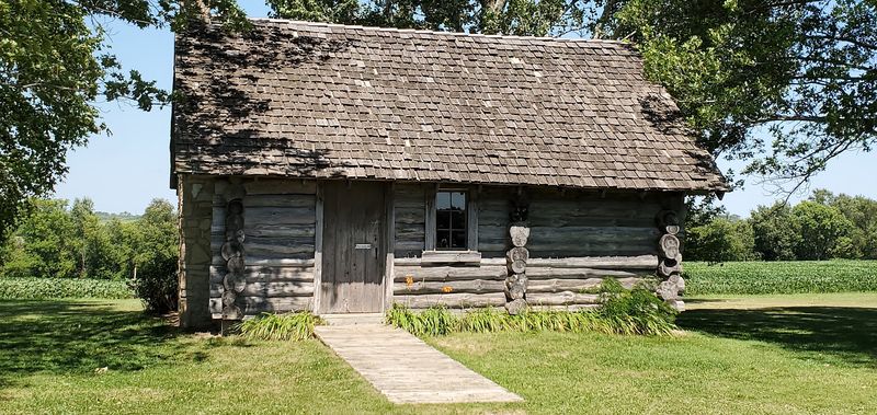 A Recreated Little House Cabin Stands North Of Town