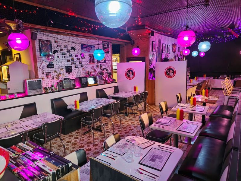 Retro TVs And Pop-Culture Décor Fill The Space