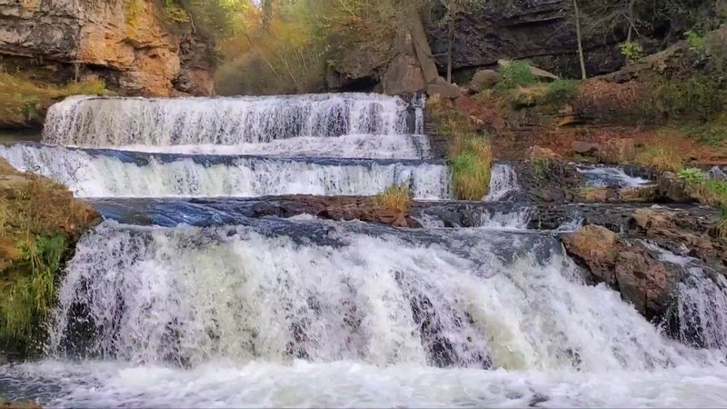 The Falls Drop Through A Dramatic River Gorge