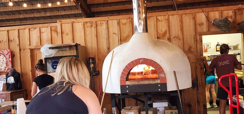 The Pizza Comes Out Of A Wood-Fired Oven