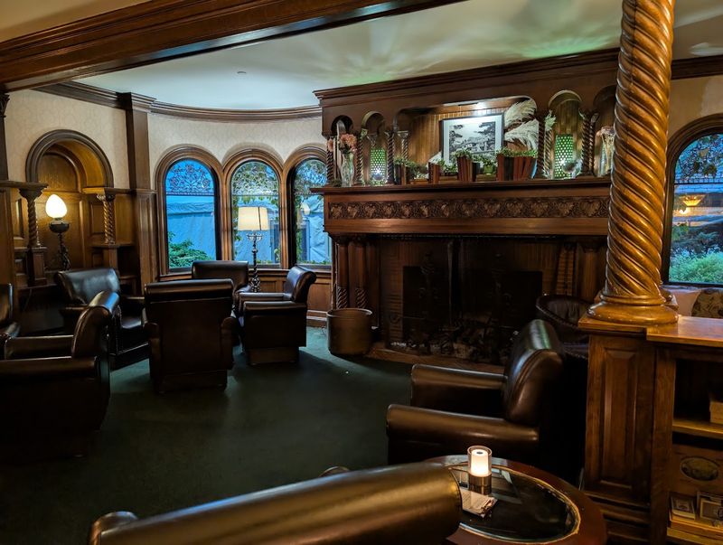 Leaded Glass, Dark Wood, And Period Chandeliers Create Real Ambiance