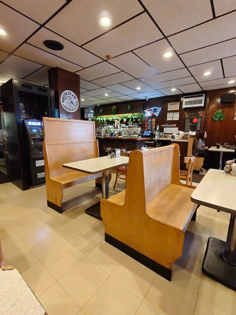 Old Metal Tables And Wooden Booths Set The Mood