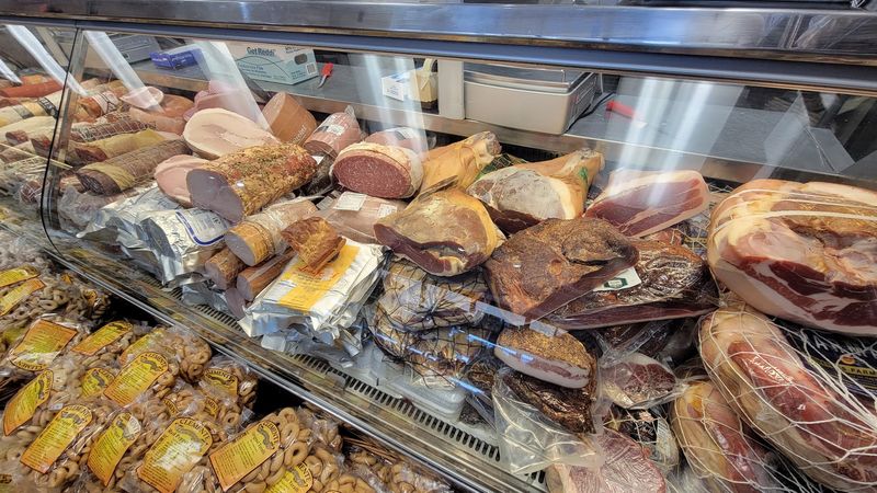 The Deli Counter Is Stacked With Imported Italian Meats