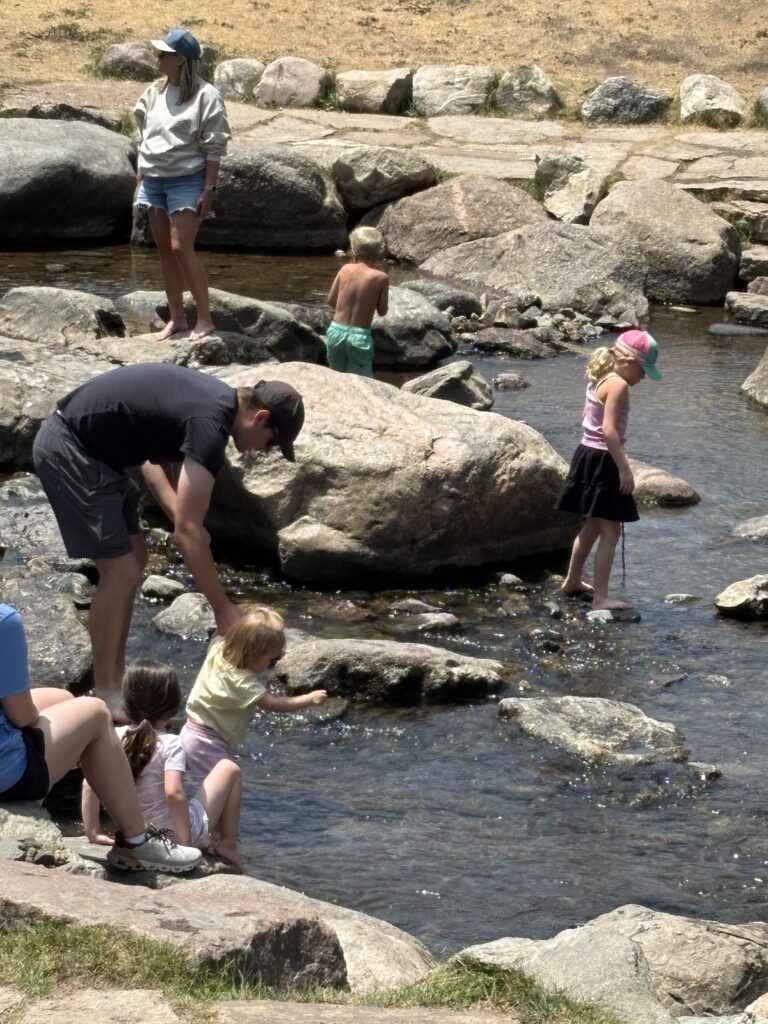 Kids and parents splashing in the Blue River in Breckenridge Colorado (Andy Yemma photo)