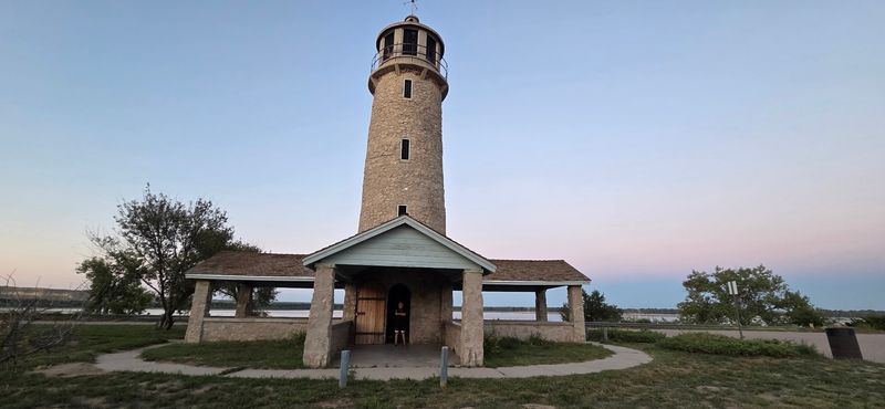 A Stone Lighthouse Makes This Shoreline Unforgettable