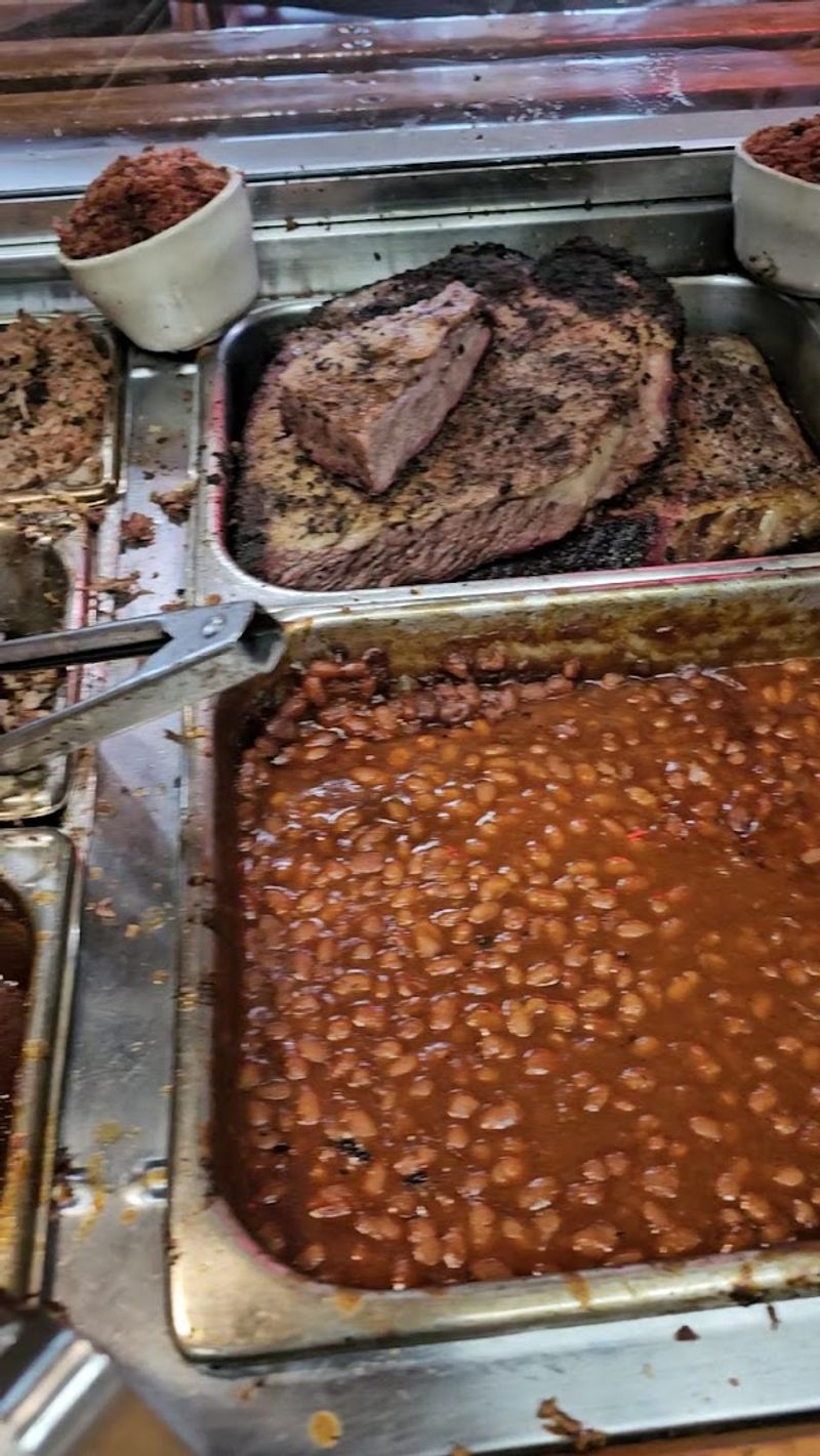 Even The Beans Spend Time In The Pit Beneath A Layer Of Chopped Ham