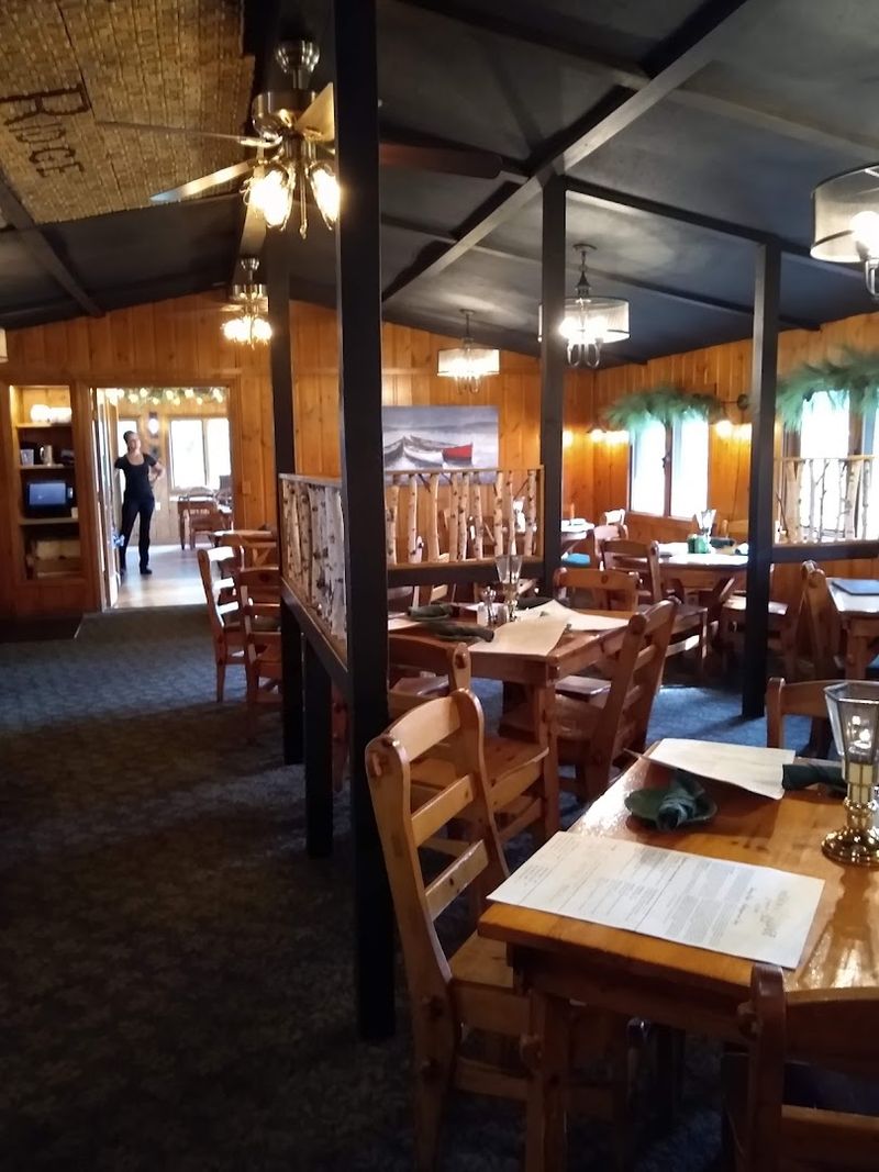 Knotty Pine Walls And Antler Chandeliers Set The Mood
