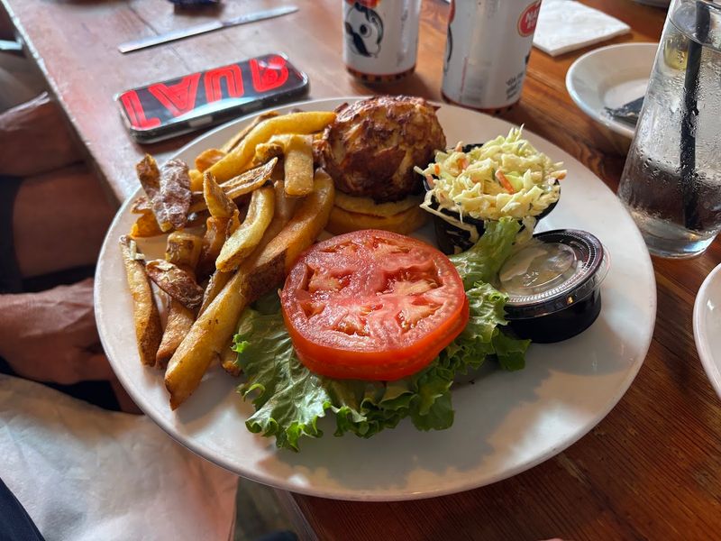 Crab Cake Scallops Tilapia And Shrimp Crowd Onto One Hearty Platter