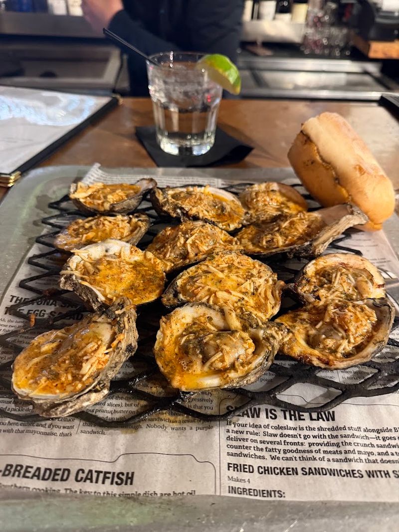 Charbroiled Oysters Arrive Bubbling With Garlic Butter And Parmesan