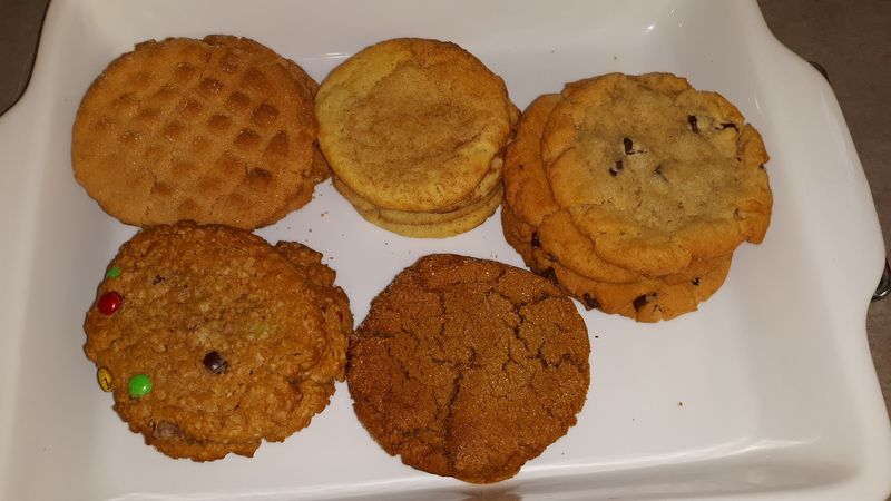 Cookies, Rolls, Bread, And Cakes Fill The Rest Of The Counter
