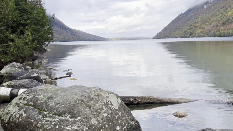 The Water Is Clear Enough To Reveal Stones Beneath The Surface