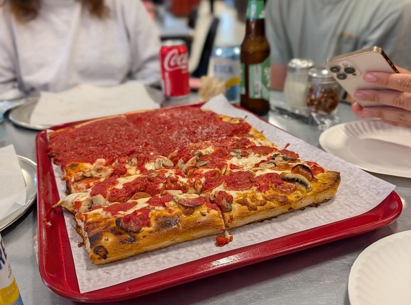The Large Rectangular Pizzas Were Made For Sharing Around The Table