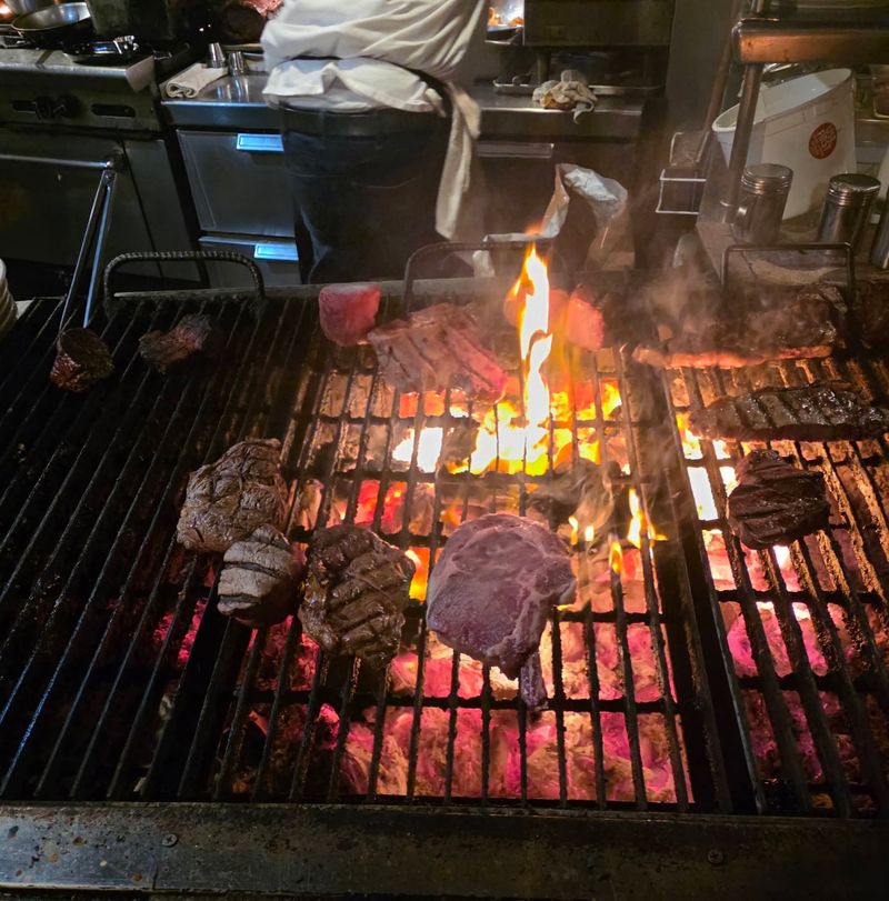 Mesquite-Grilled Steaks Cooked Over Open Flame