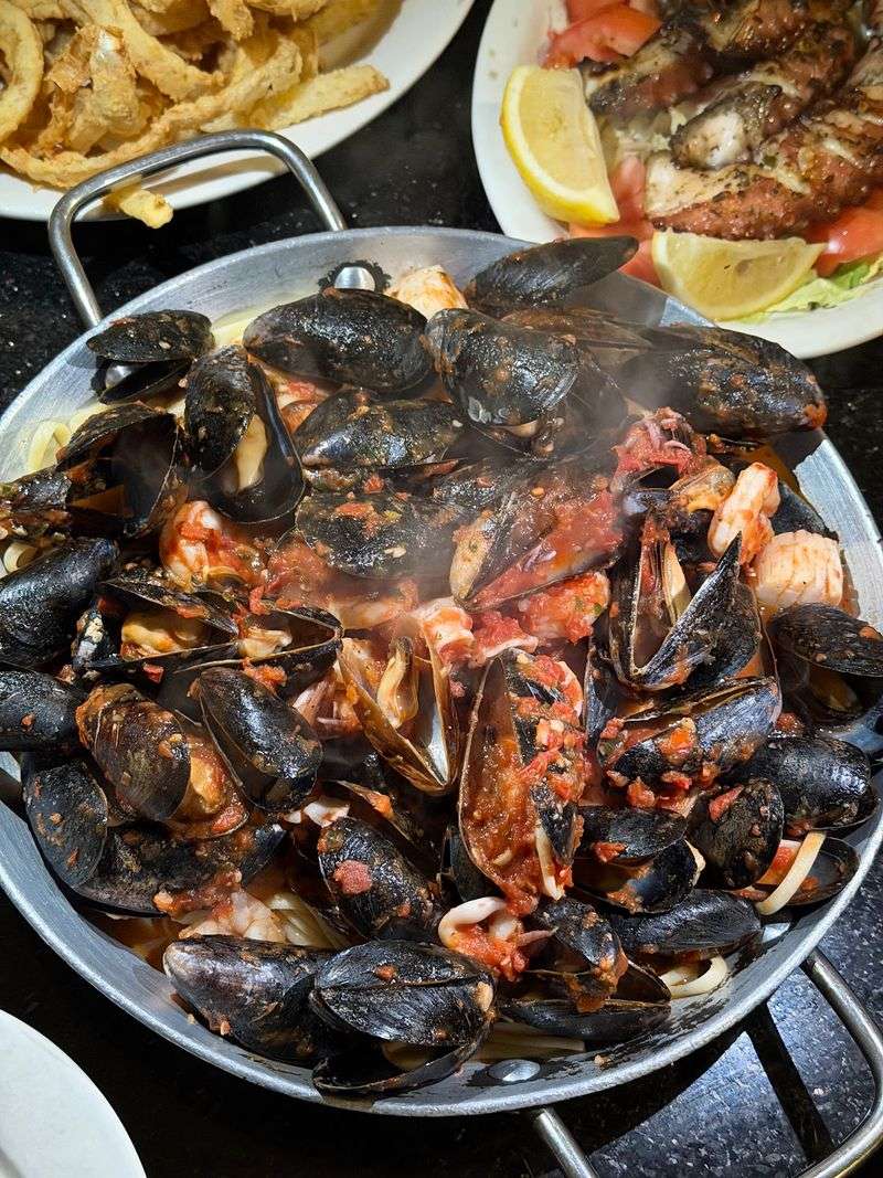 Italian Plates Sitting Comfortably Beside The Seafood