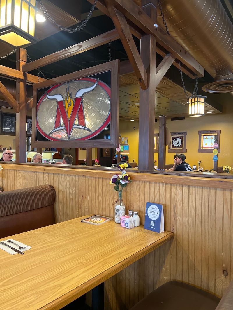 Wooden Booths And Warm Yellow Walls