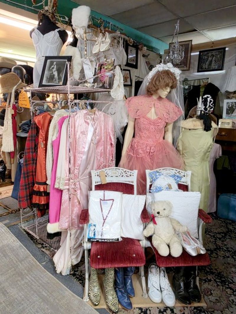 Racks Of Clothing With Decades Behind Them