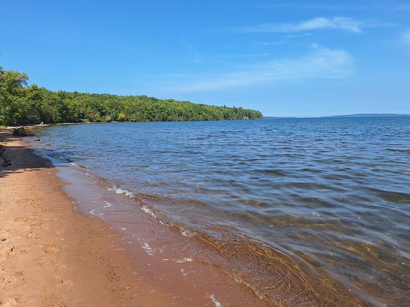 A Sandy Beach With Beautiful Island Views
