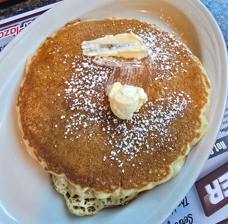 Pancakes That Hang Over The Edge Of The Plate