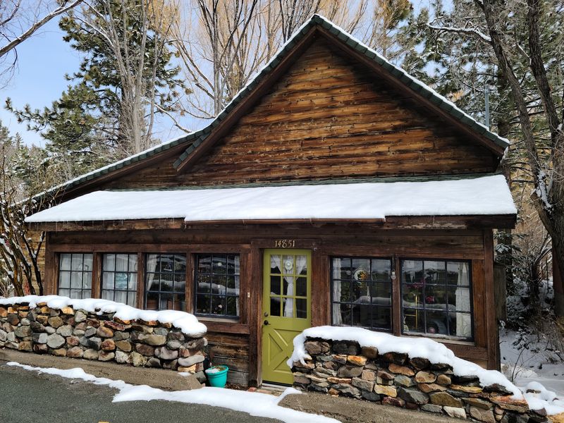 A Hilltop Museum With A Log Jail