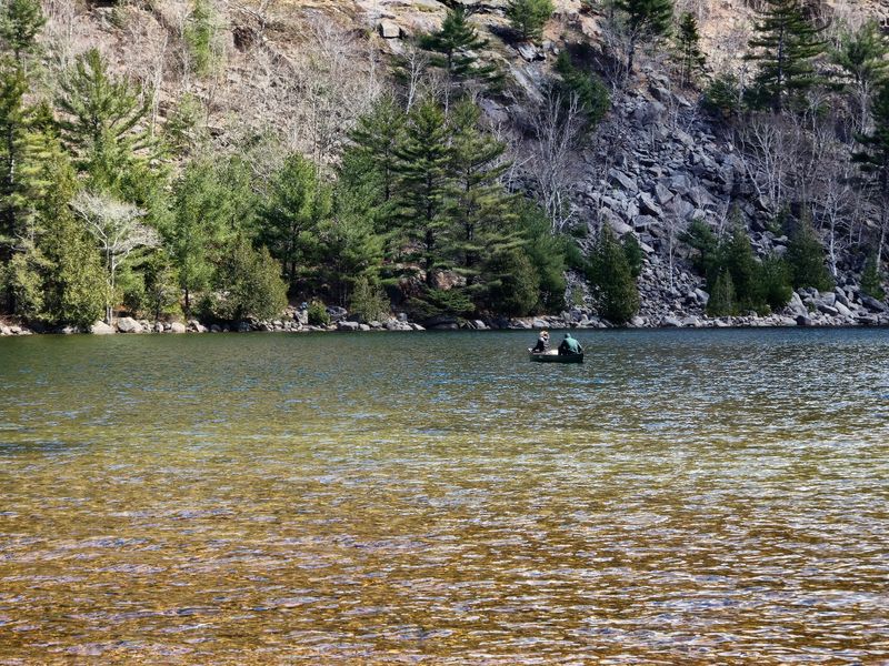 Paddling Across Glassy Calm