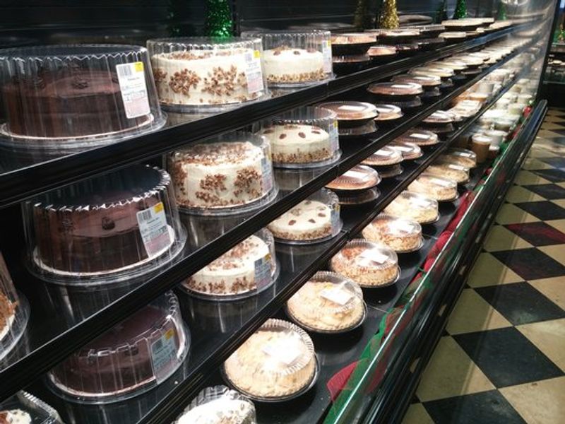 Bakery Cases Stacked With Pies And Cakes