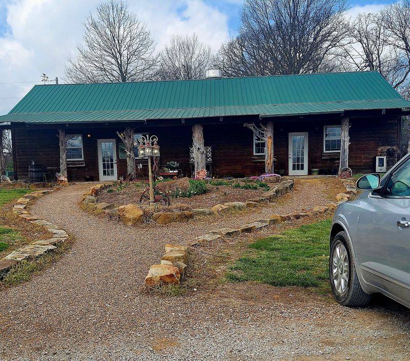 A Log Cabin Where You Expect A Farmhouse