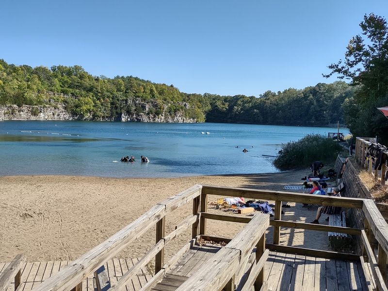 A Sandy Beach With Cliffs For A Backdrop