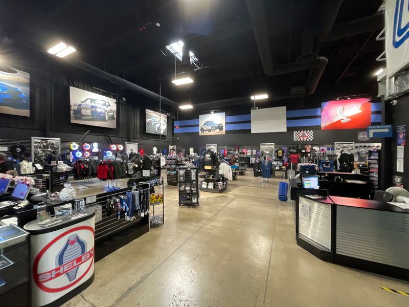 A Gift Shop With Superchargers And A Surfboard