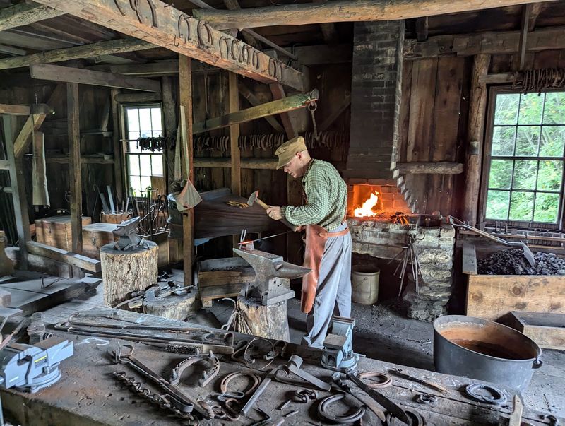 Blacksmiths Hammering Iron Into Shape
