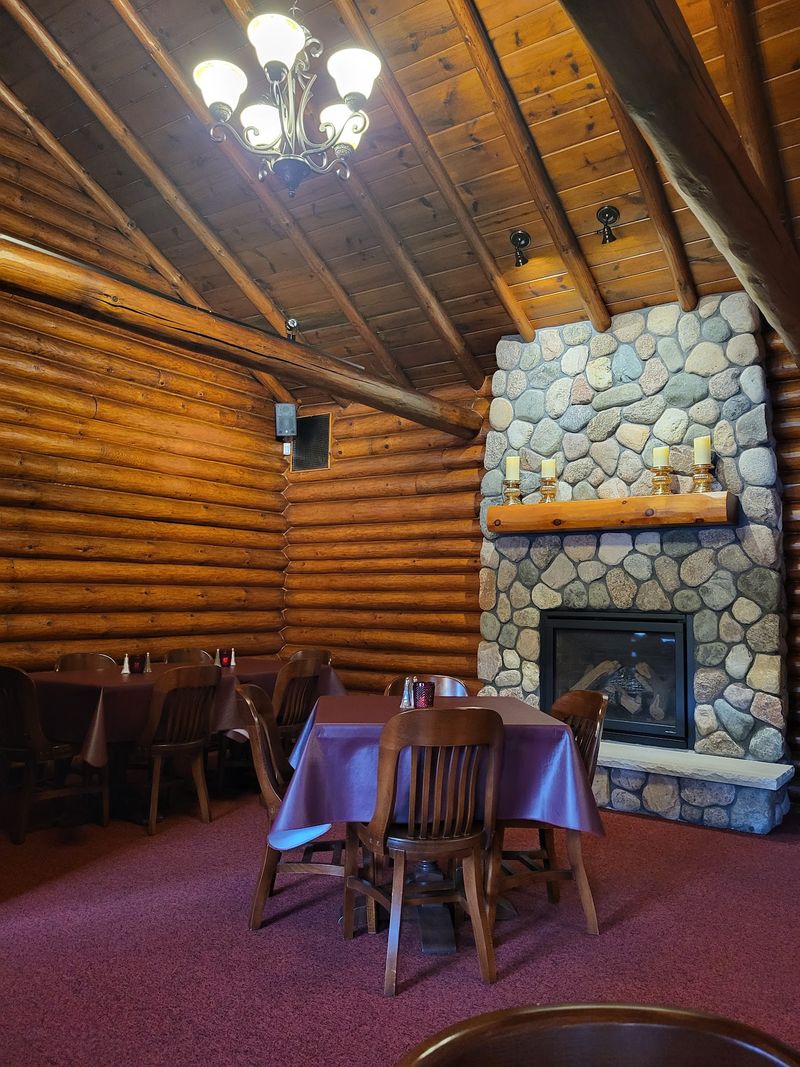 Log Walls And Fireplaces Set The Mood