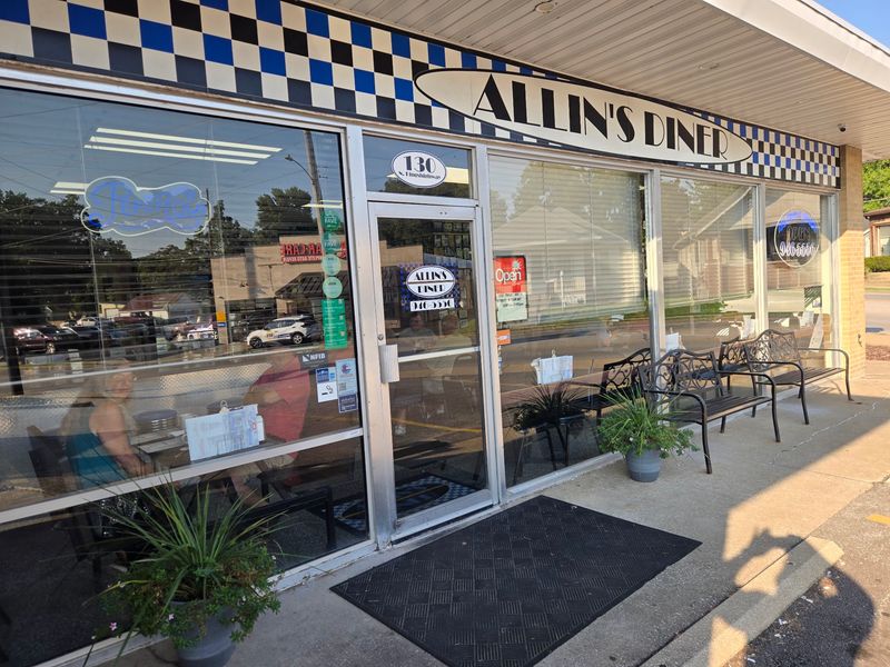 The Blue-Checkered Storefront That Signals Something Old-School