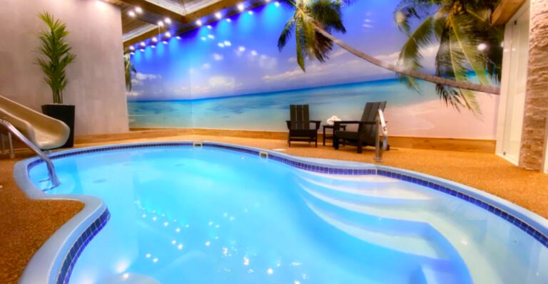 This Secret Wisconsin Adults-Only Suite Features A Private Indoor Pool Waterfall And A Whirlpool Tub