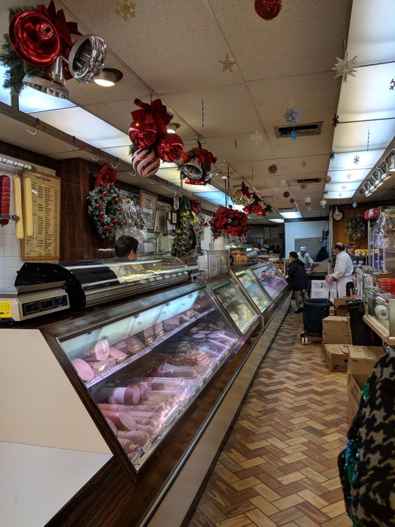 Old School Butchers Working Behind The Counter