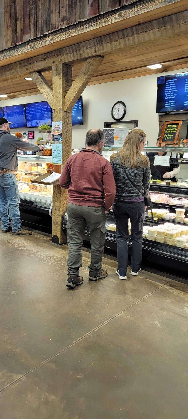 The Deli Counter and Its Stacked Sandwiches