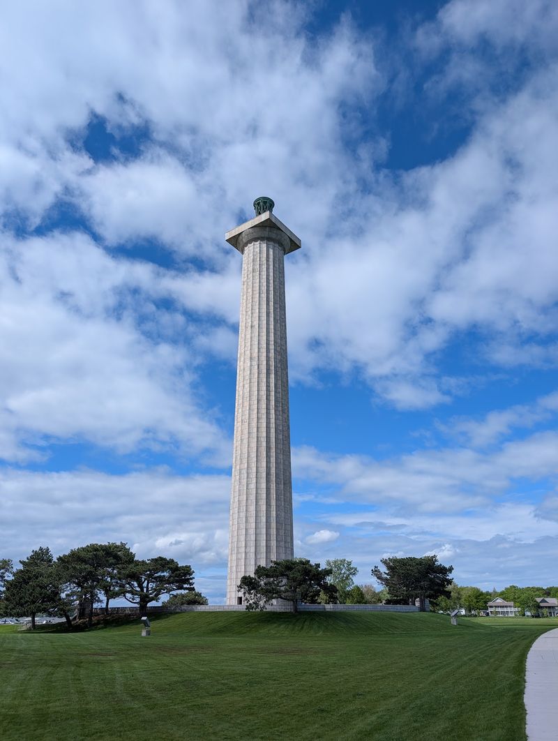 A Stone Column Rising From A Small Island