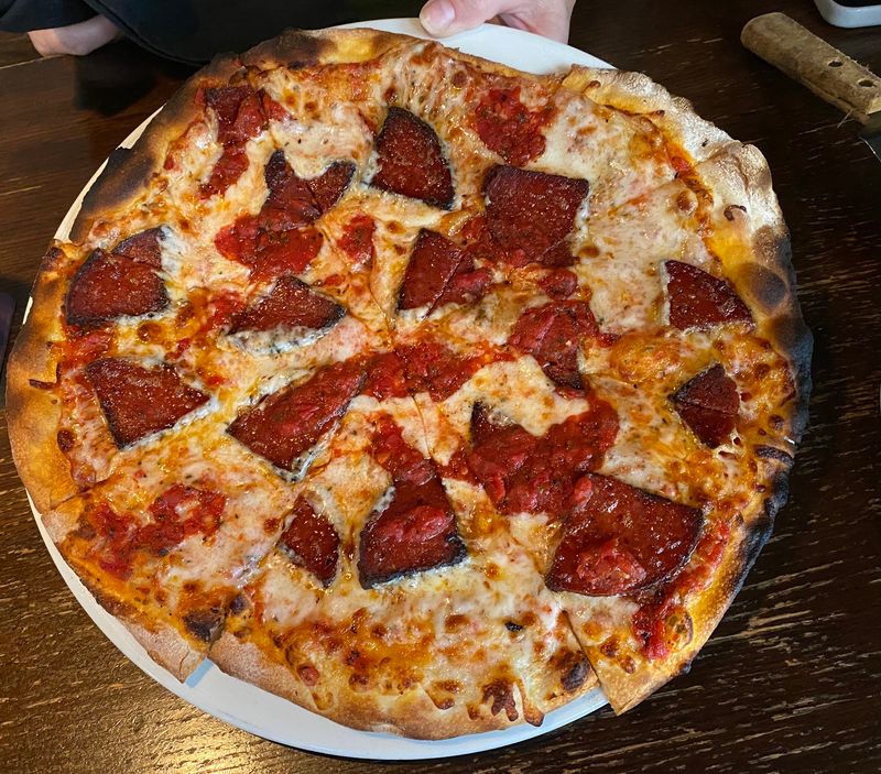 Wood Fired Pizzas With A Cracker Thin Crust