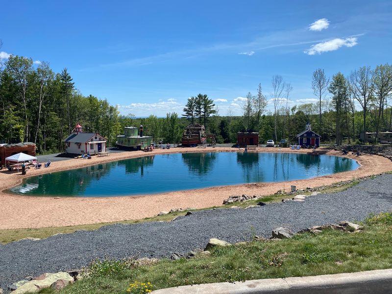 A Swimming Pond With Real Sand Underfoot