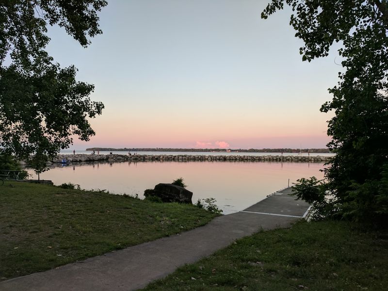 Picnic Tables, Charcoal Grills, and a Calm Beach Nearby