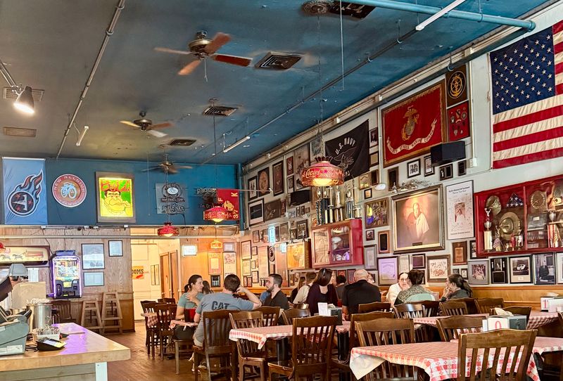 Walls Covered In Flags, Awards, And Odd Treasures