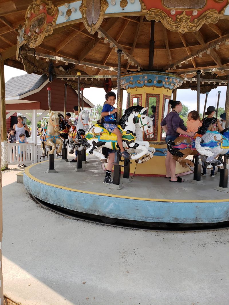Carousel Horses, A Miniature Train, And A Bouncing Cow